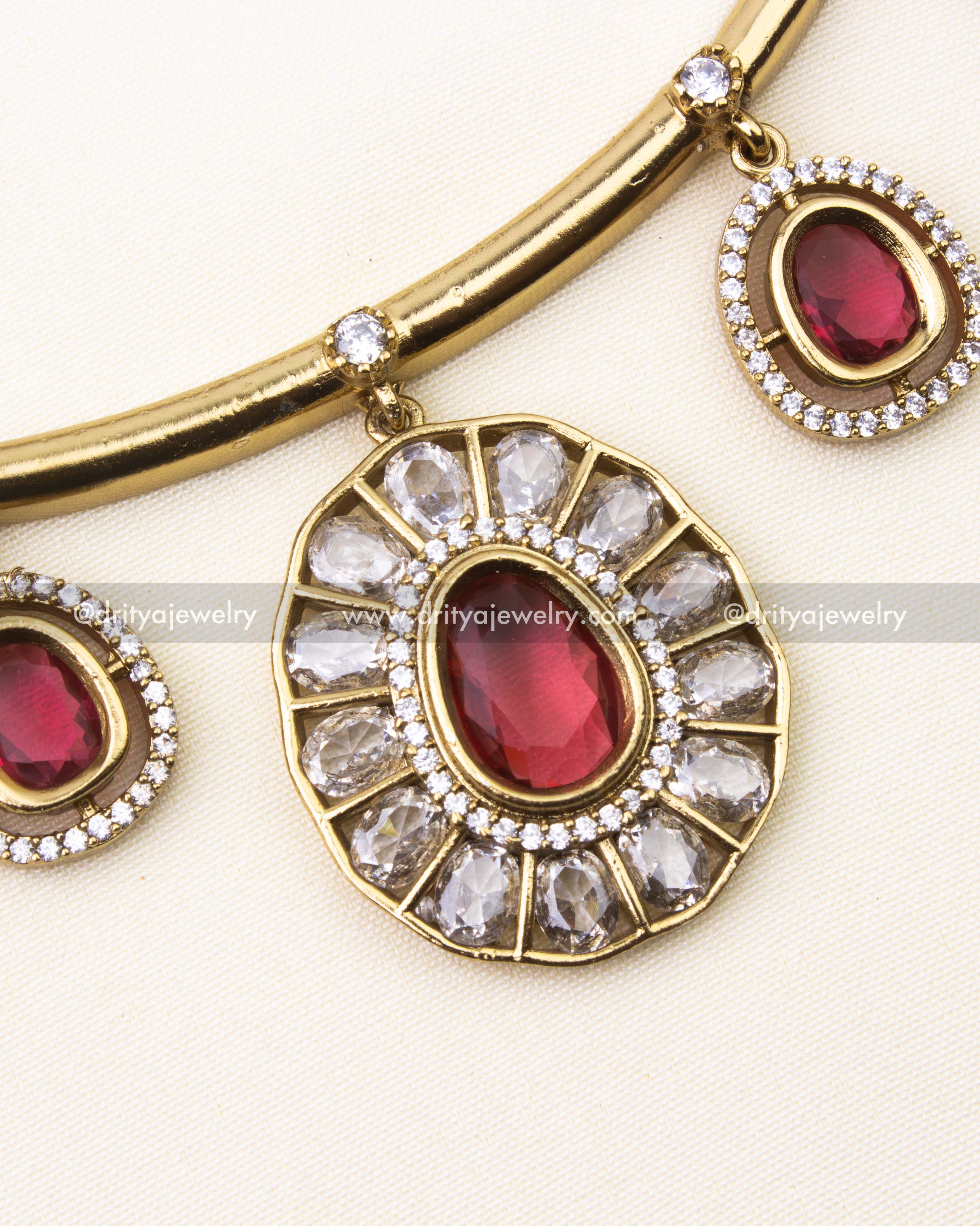 Close-up view of red Hasli necklace pendant with diamonds