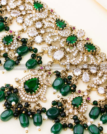 Detailed close-up showing intricate Victorian motifs and green centerpiece
