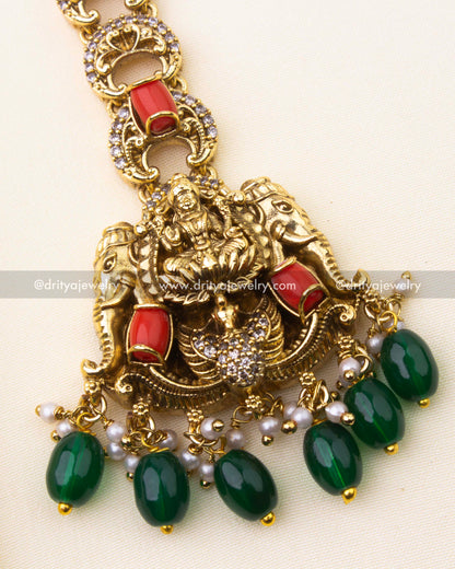 Detailed Lakshmi Devi motif with coral and green bead drops