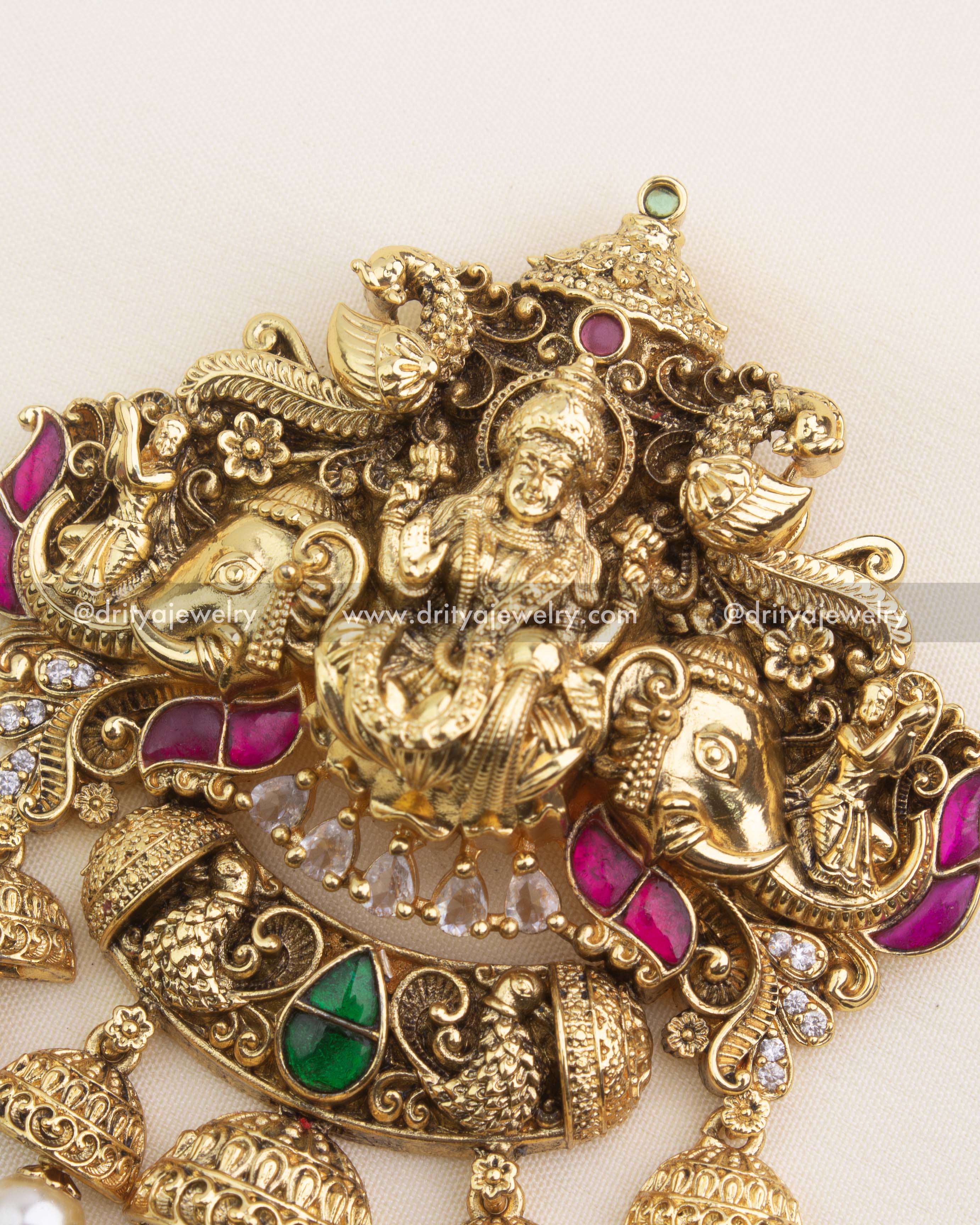 Close-up of Lakshmi Nakshi pendant with kemp stones and pearl hangings – temple jewelry