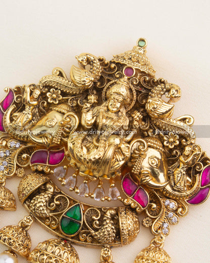 Close-up of Lakshmi Nakshi pendant with kemp stones and pearl hangings – temple jewelry