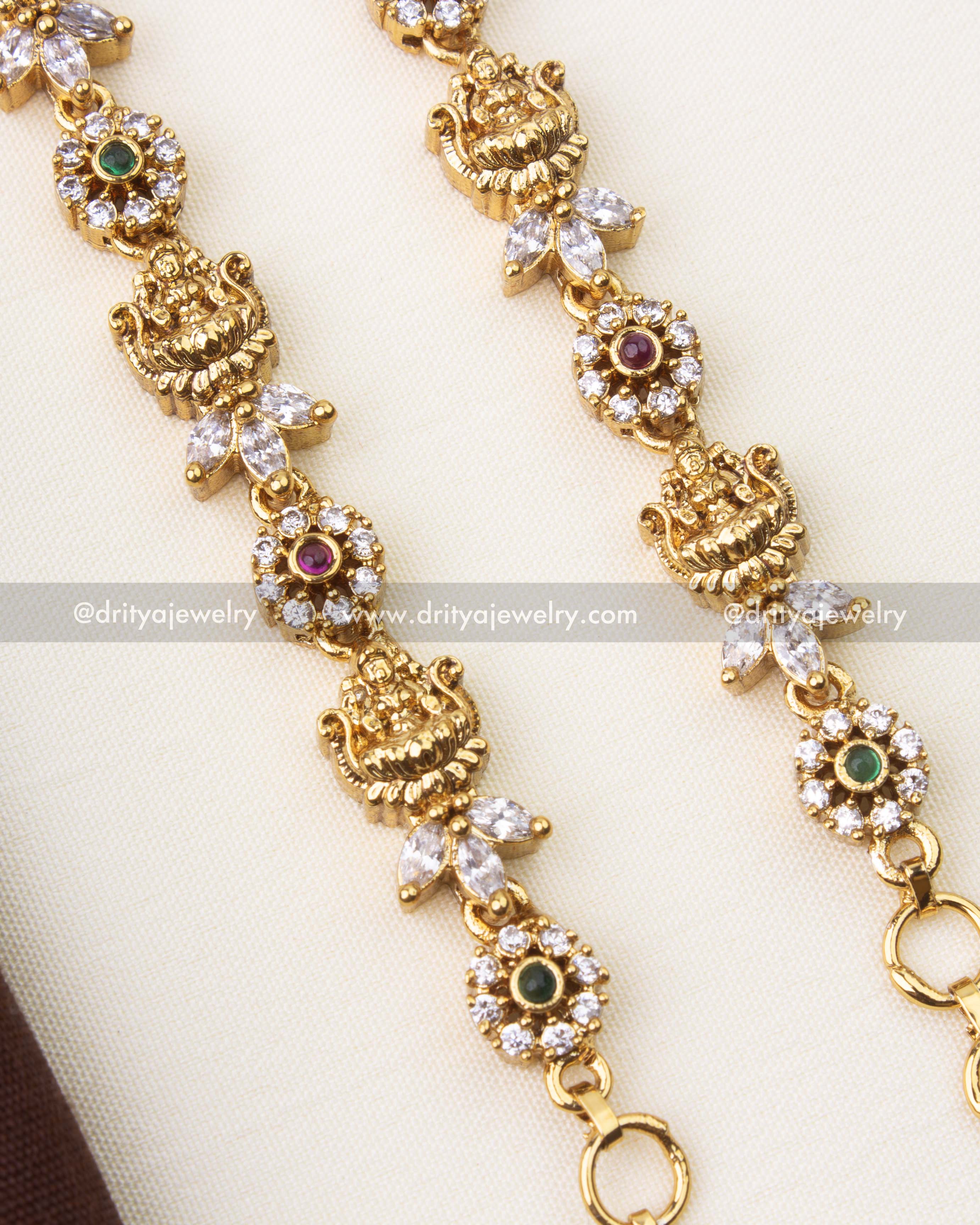 Close-up of temple-inspired matilu showing CZ stone clusters and intricate gold polish work