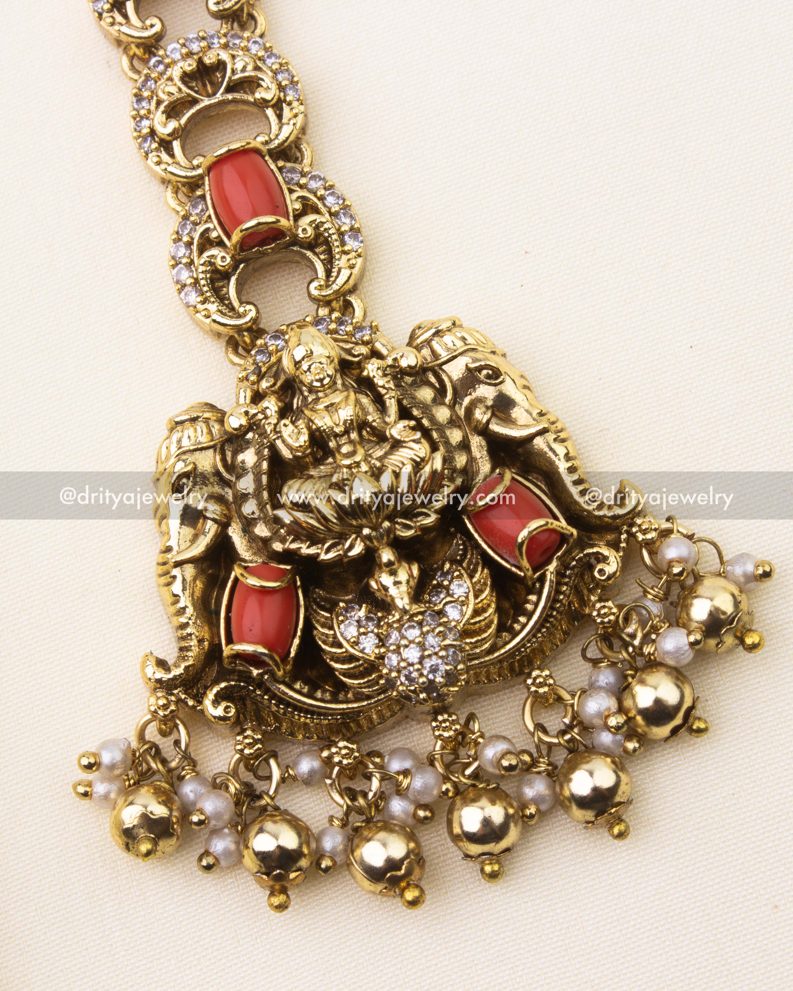 Antique Lakshmi Devi motif with coral and golden ball finish