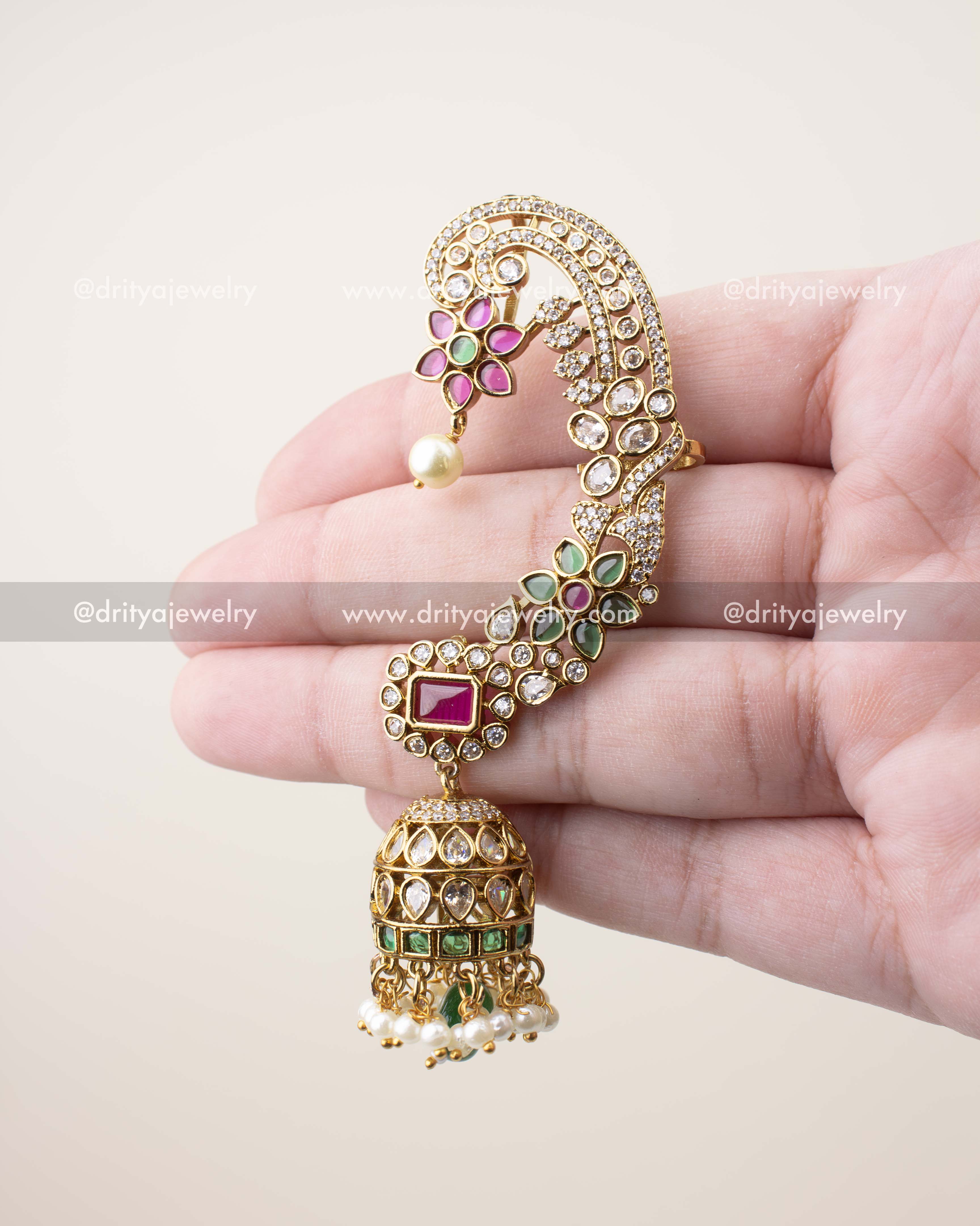 Close-up of floral ear cuff featuring high-quality CZ stones, pearl drops, and antique gold polish