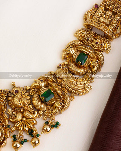 Side segment of necklace featuring nakshi peacocks with green square stones