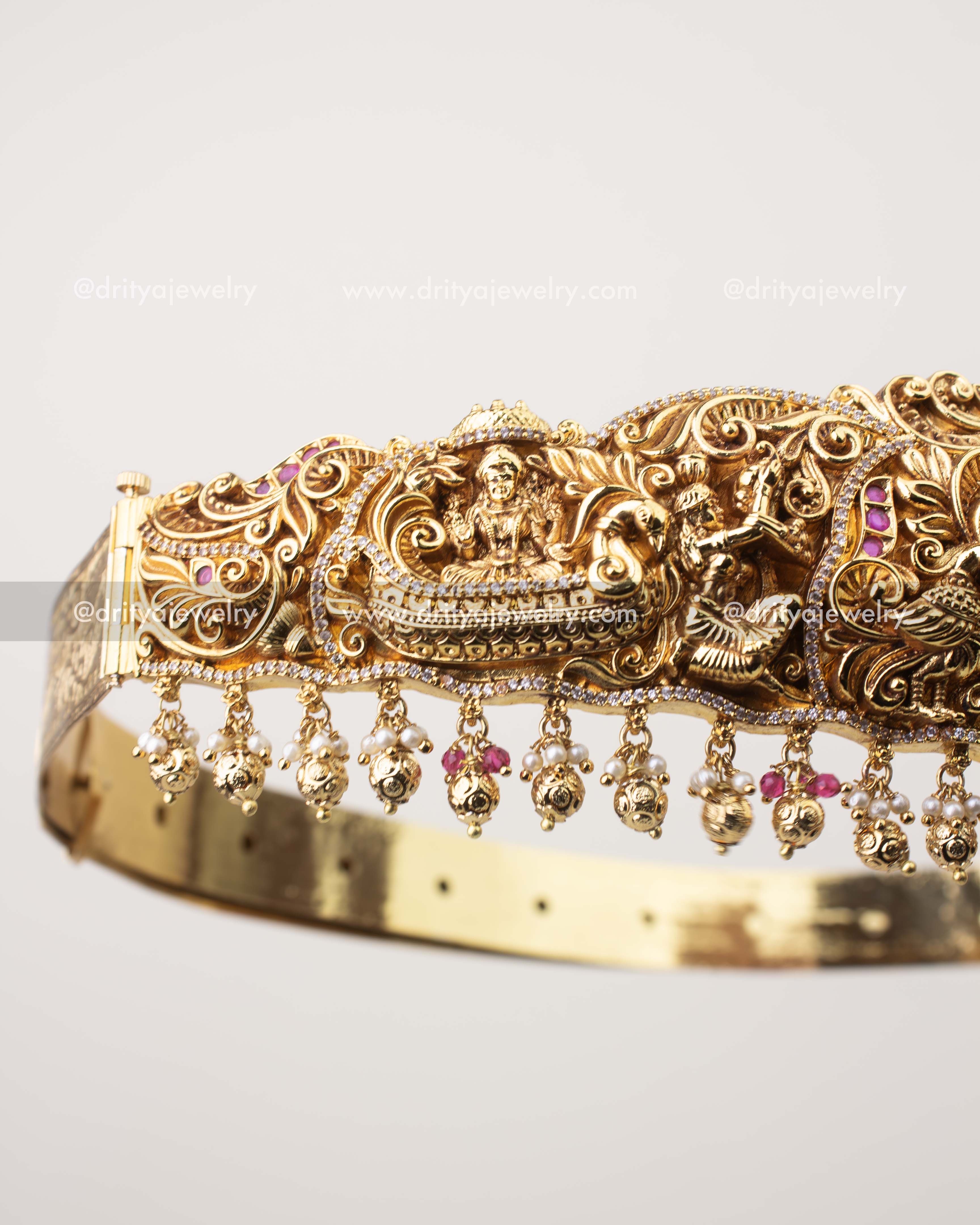 Intricate nakshi floral detailing with CZ stones on bridal temple vadanam