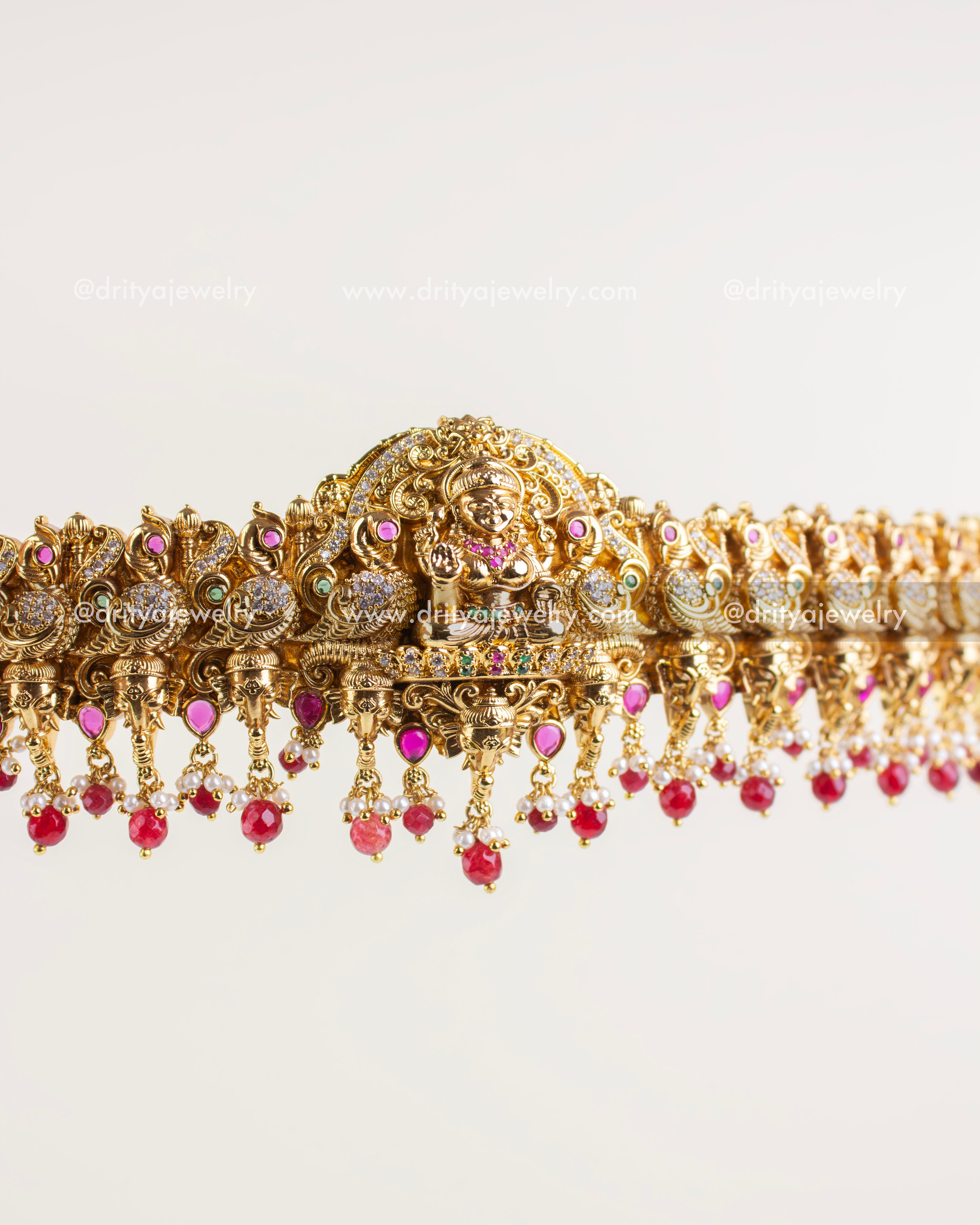 Detailed look of the Lakshmi Devi motif with embedded stones.