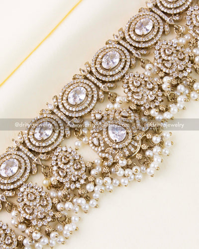 Zoomed view of diamond-like AD stones and Victorian pattern with pearls.