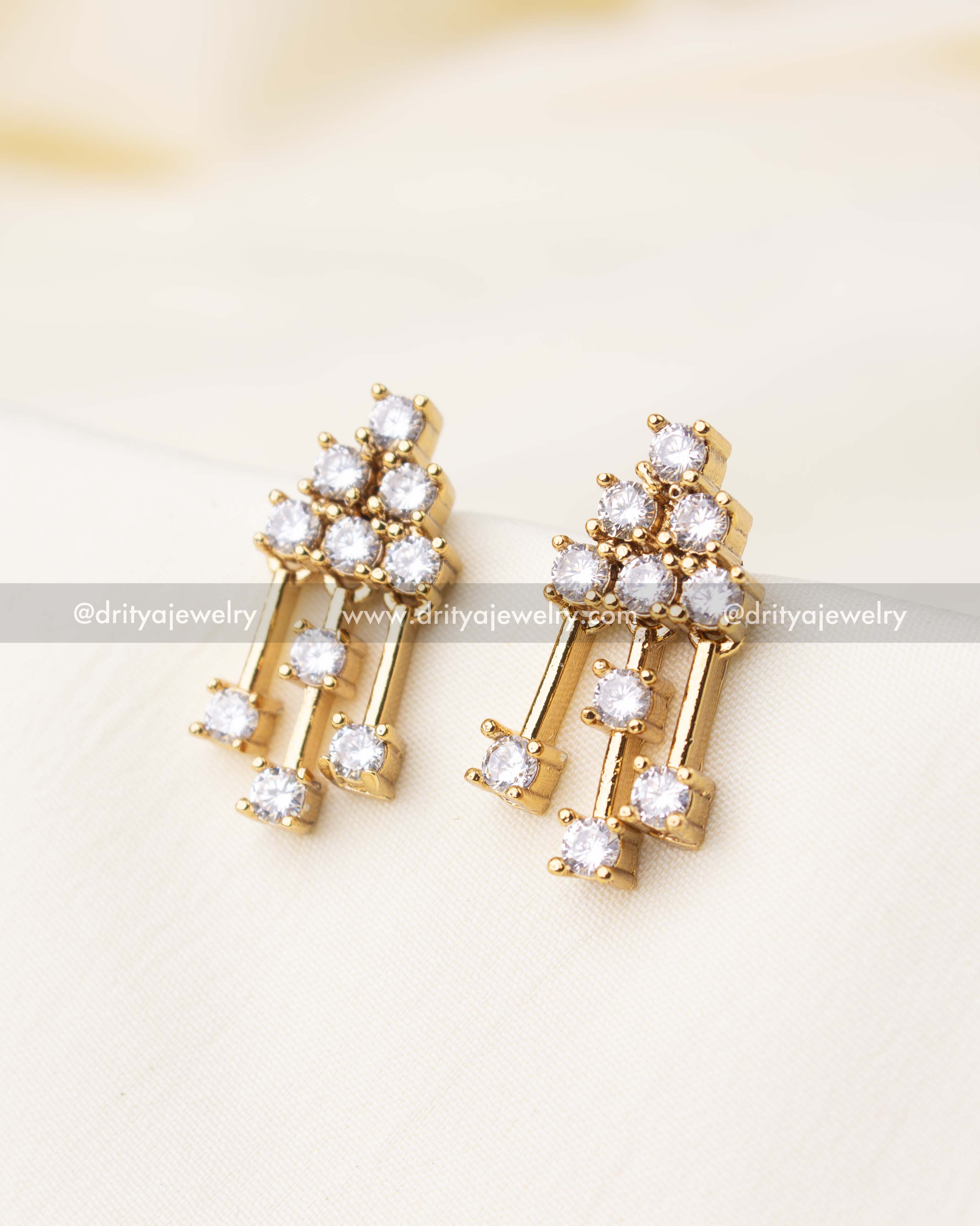 Drop earrings with sparkling white CZ stones arranged in elegant clusters.