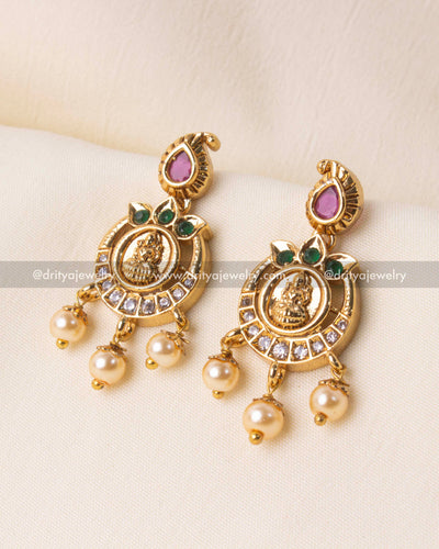 Elegant long necklace set featuring Lakshmi Devi coin motifs and polki stones with gold plating, ideal for weddings and festivities.