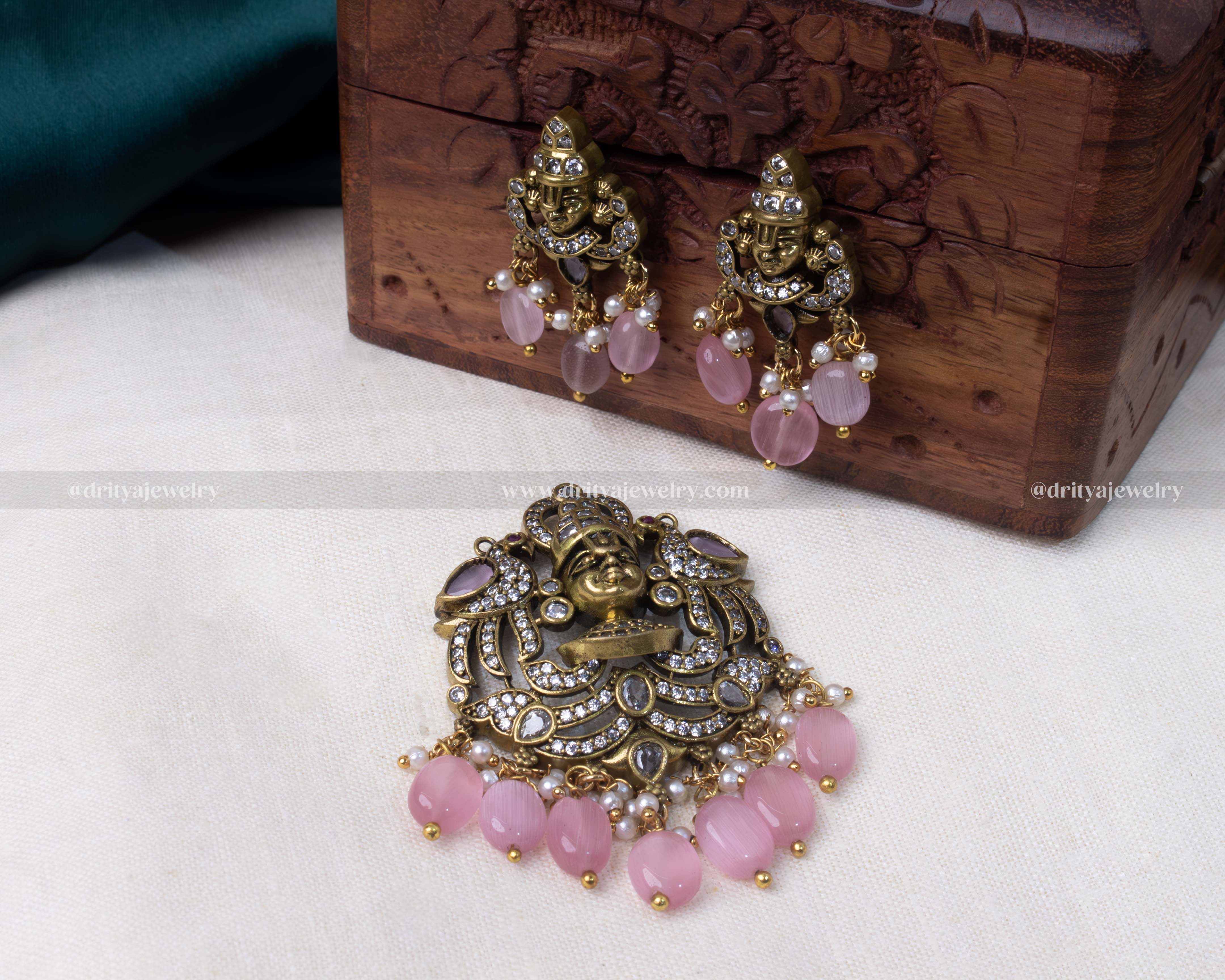 Antique Victorian polished Venkateshwara Swamy pendant set with cubic zirconia stones, pink beads, and matching earrings, perfect for traditional and festive occasions.