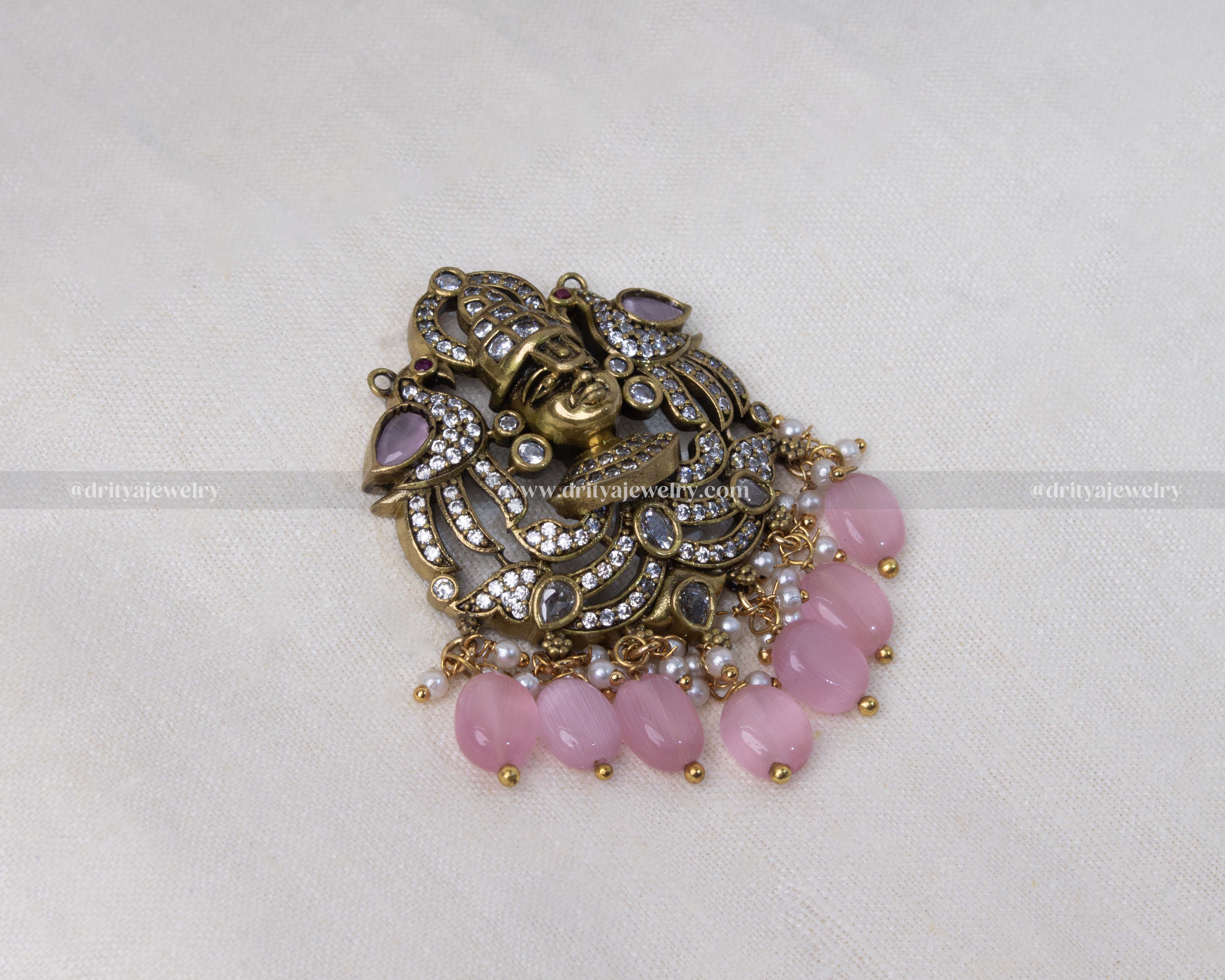 Antique Victorian polished Venkateshwara Swamy pendant set with cubic zirconia stones, pink beads, and matching earrings, perfect for traditional and festive occasions.