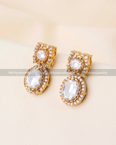 Double kundan earrings in gold tone with red and white accents.