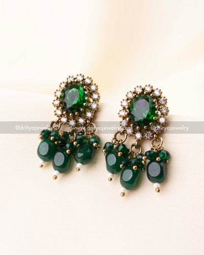 Matching green stone earrings with cluster drop detailing