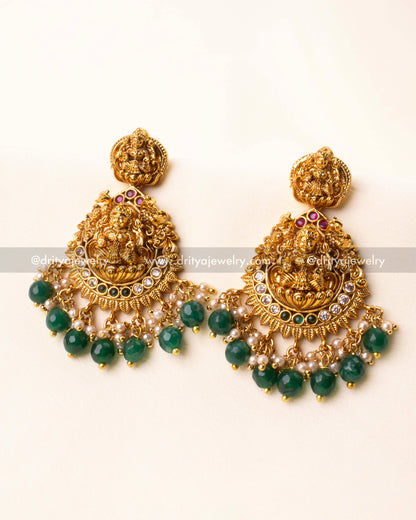 Temple earrings with Lakshmi carving and green bead danglers matching the necklace.
