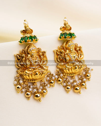 Matching Lakshmi dangler earrings with pearl and gold ball drops