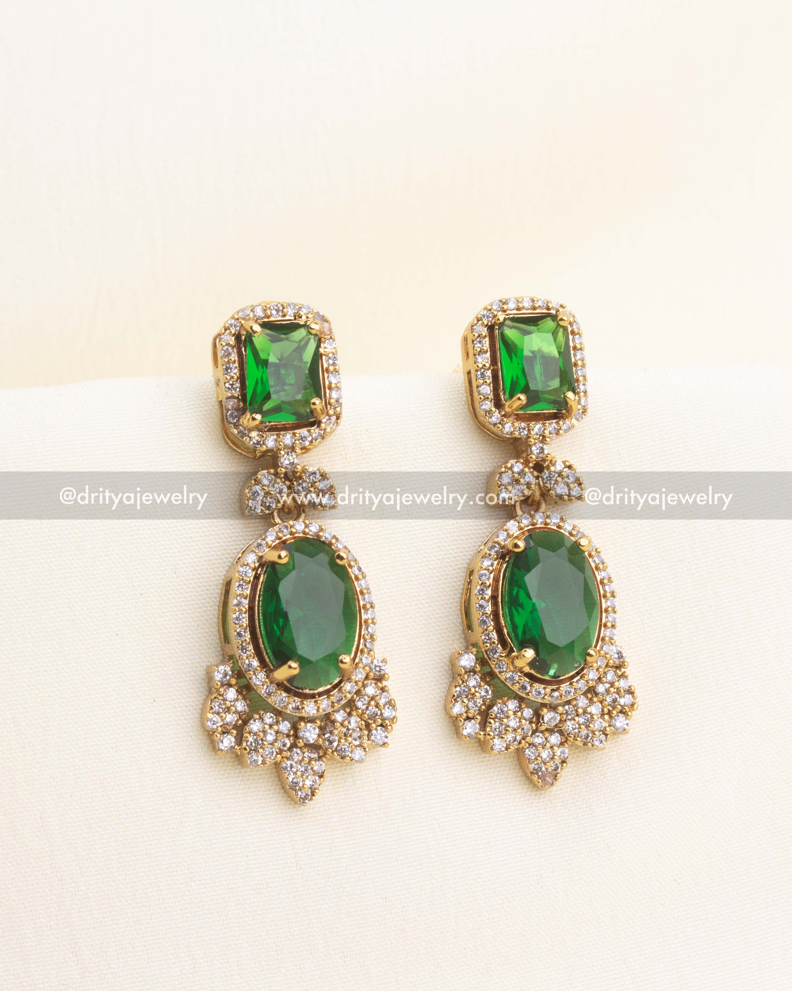 Green CZ drop earrings with double stone detailing.