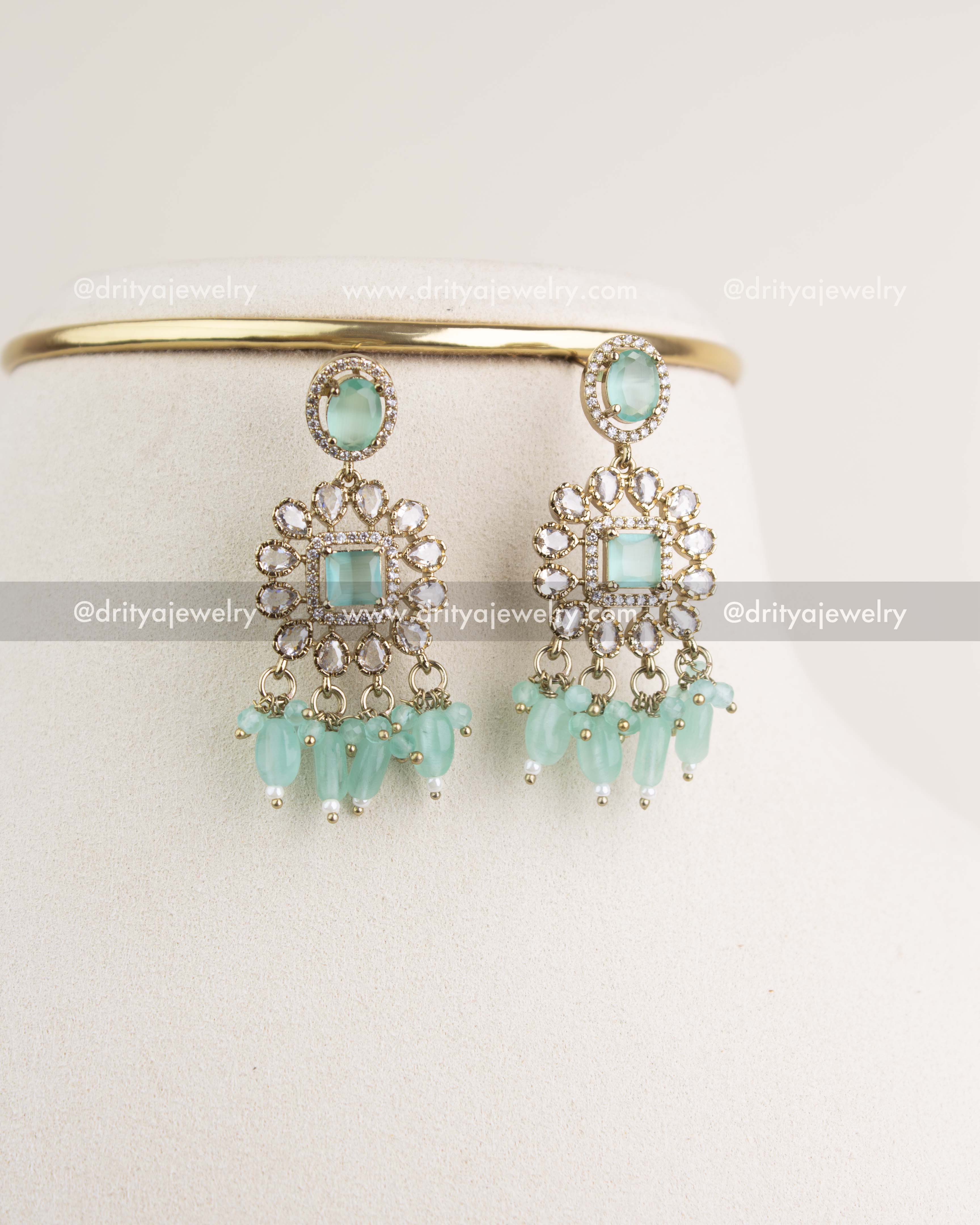 Victorian-style earrings with mint stones, CZ clusters, and hanging beads.