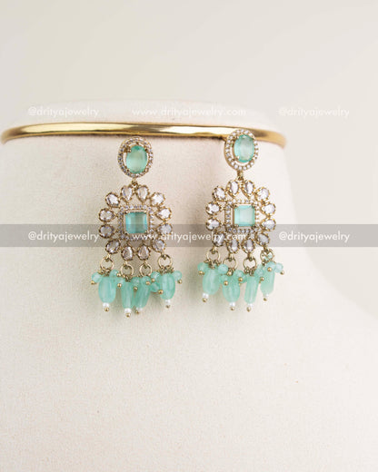 Victorian-style earrings with mint stones, CZ clusters, and hanging beads.