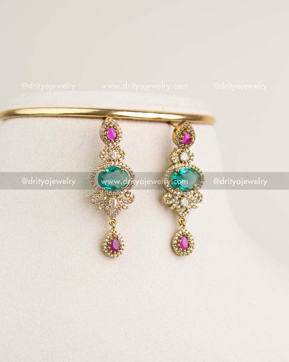 Victorian earrings with Russian emerald stones, ruby teardrops, pearls, and antique gold finish.