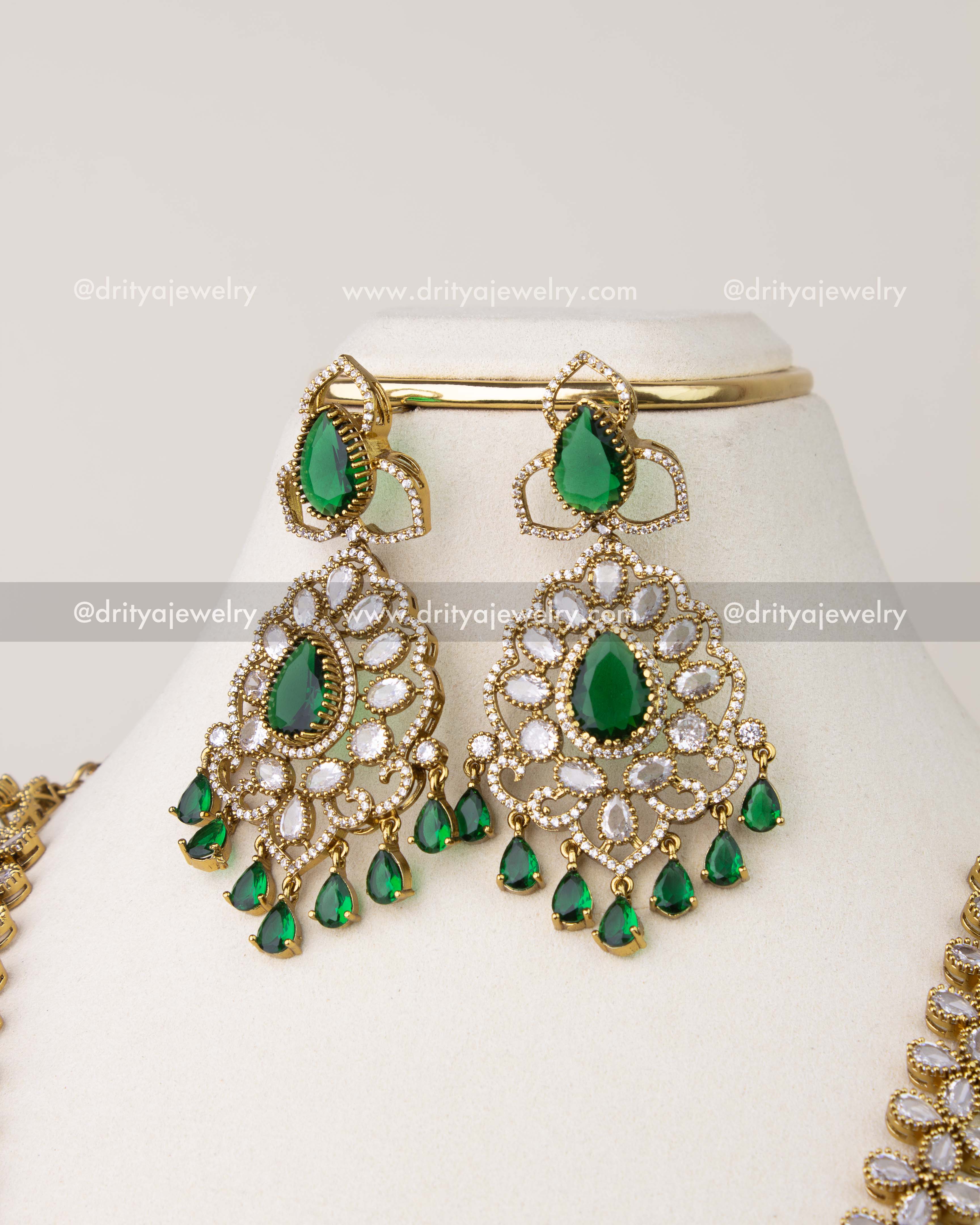 Victorian emerald earrings with teardrop hangings in antique gold finish