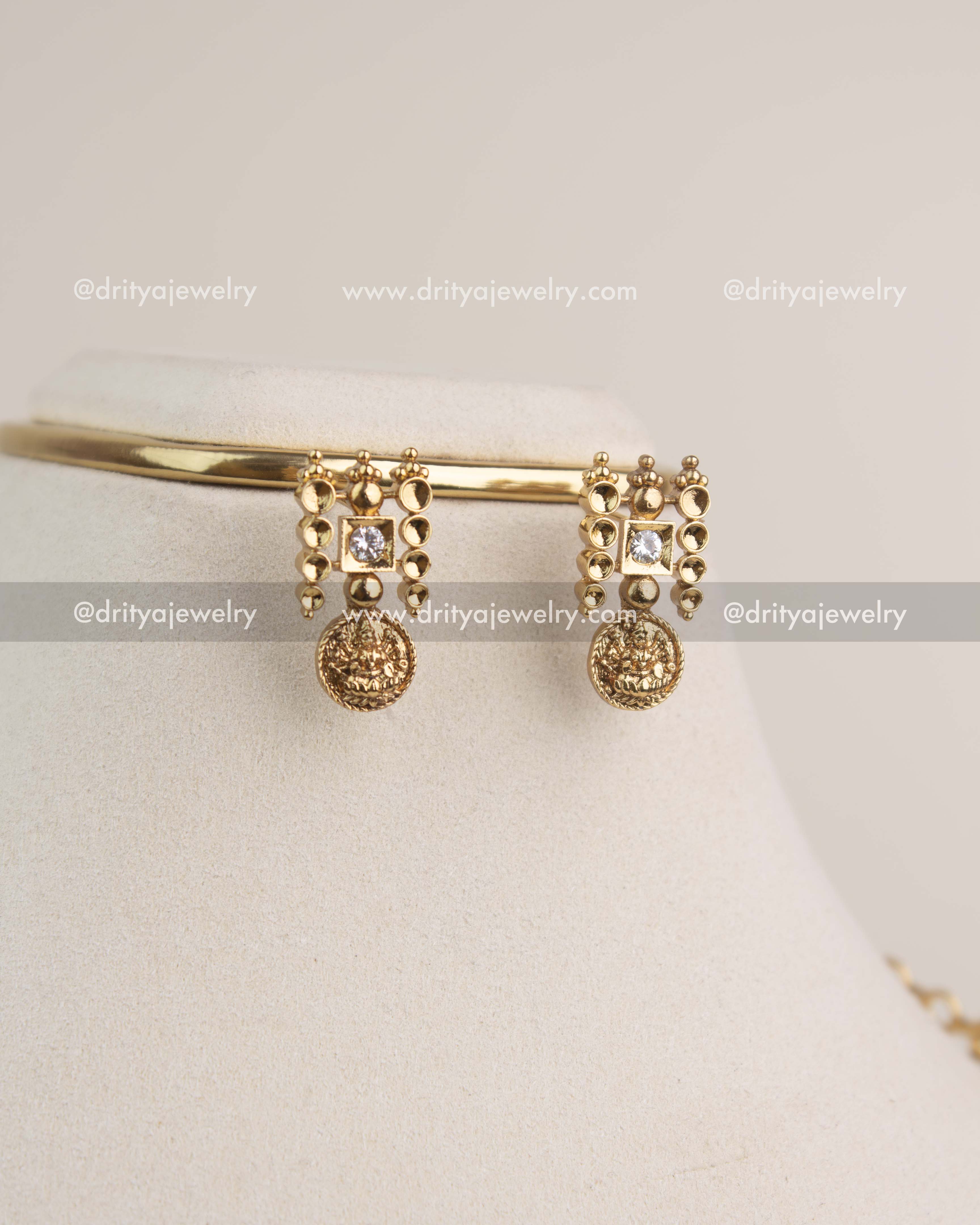 Matching kasulu coin earrings with square CZ stones in premium gold finish.