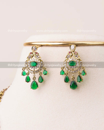 Victorian earrings featuring emerald green drops and CZ stone work