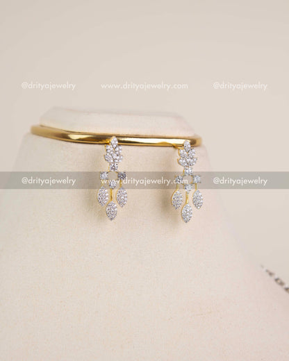 Drop earrings with CZ diamond-replica leaf design in gold polish.