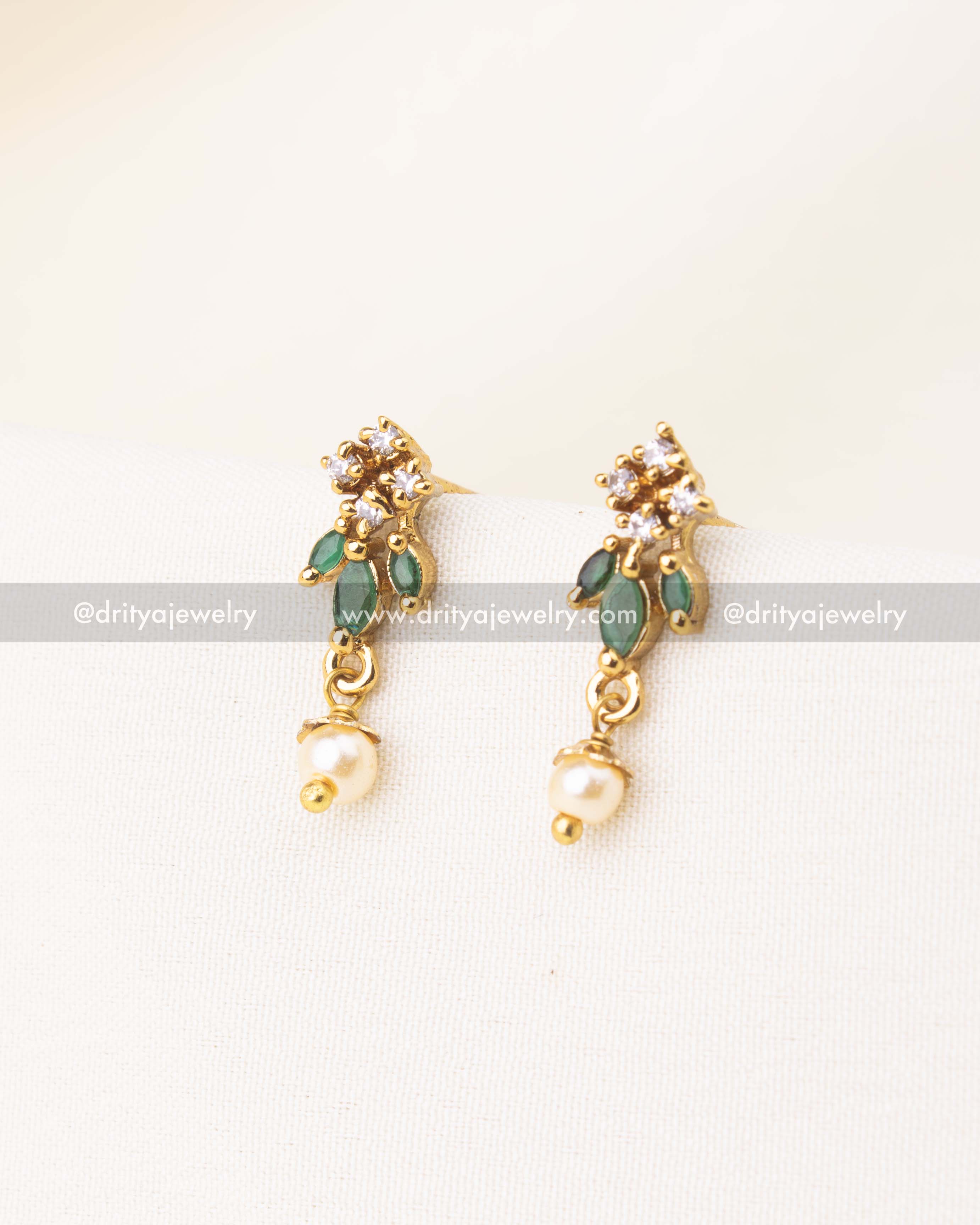 Gold-plated earrings with green accents, CZ sparkle, and pearl danglers.