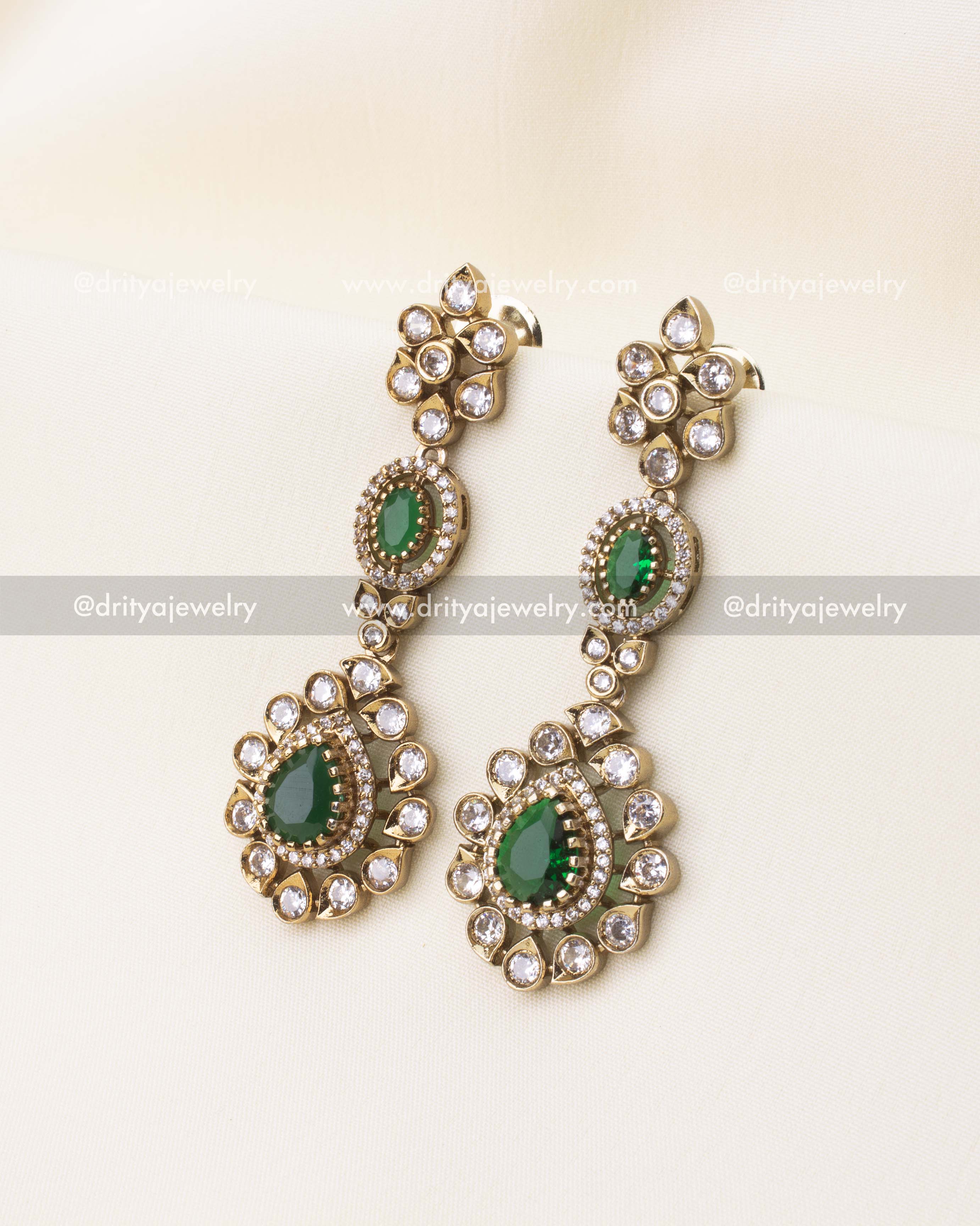Victorian style earrings with emerald green stones and gold polish