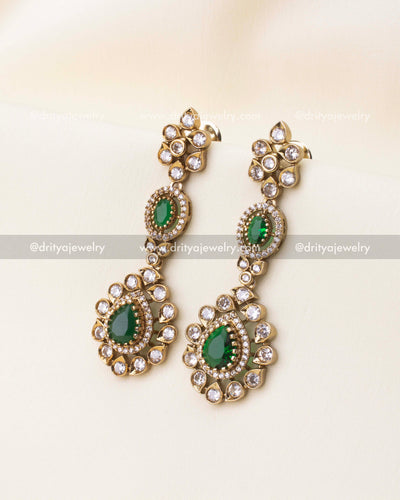 Victorian style earrings with emerald green stones and gold polish