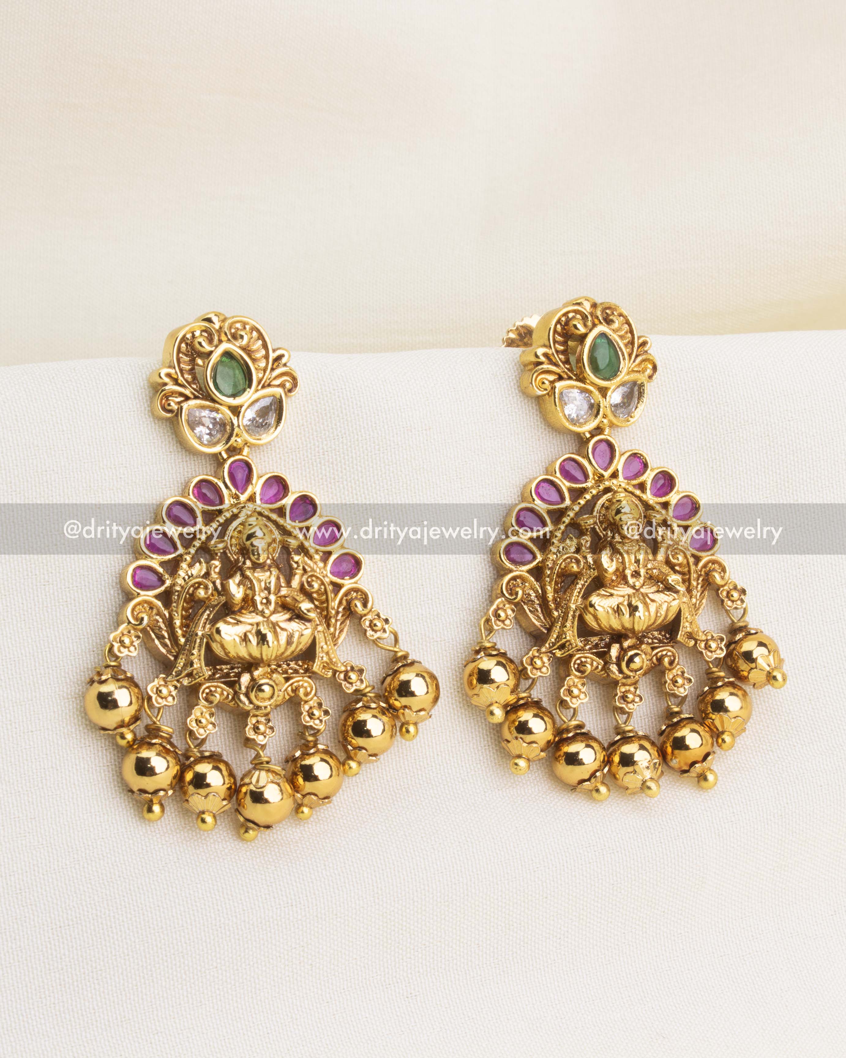 Temple earrings with Lakshmi motif, ruby arch, and gold ball drops