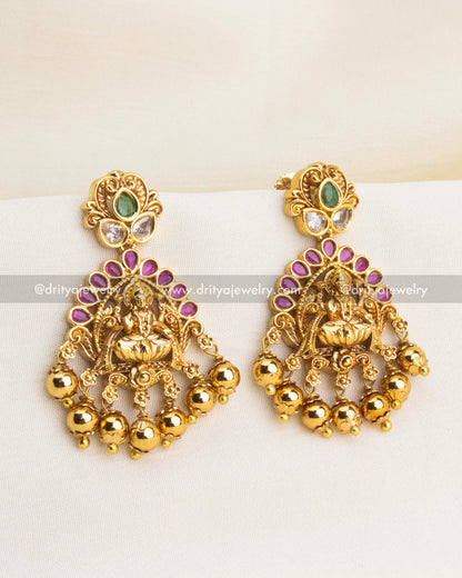 Temple earrings with Lakshmi motif, ruby arch, and gold ball drops