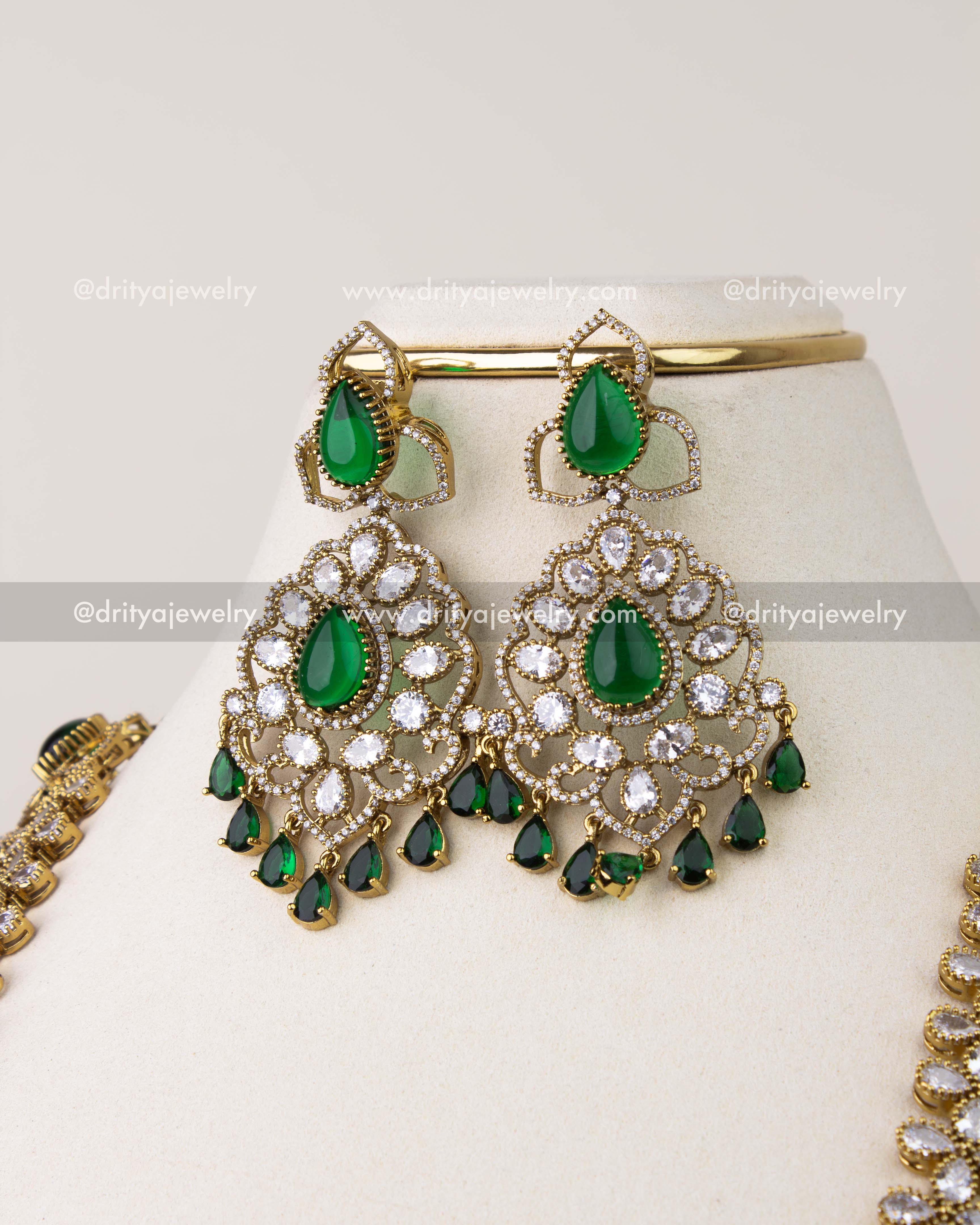 Victorian style earrings with emerald green stones and CZ accents