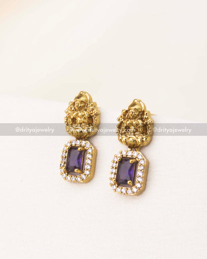 Temple-style earrings with purple CZ stone and deity embossing