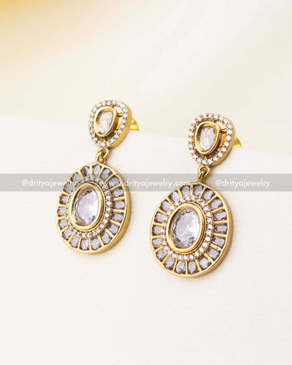 White stone earrings with circular diamond frame