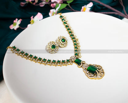 Dritya Jewelry's Elegant Dual Color CZ Necklace Set in emerald and purple, perfect for enhancing evening or bridal wear with exquisite style.