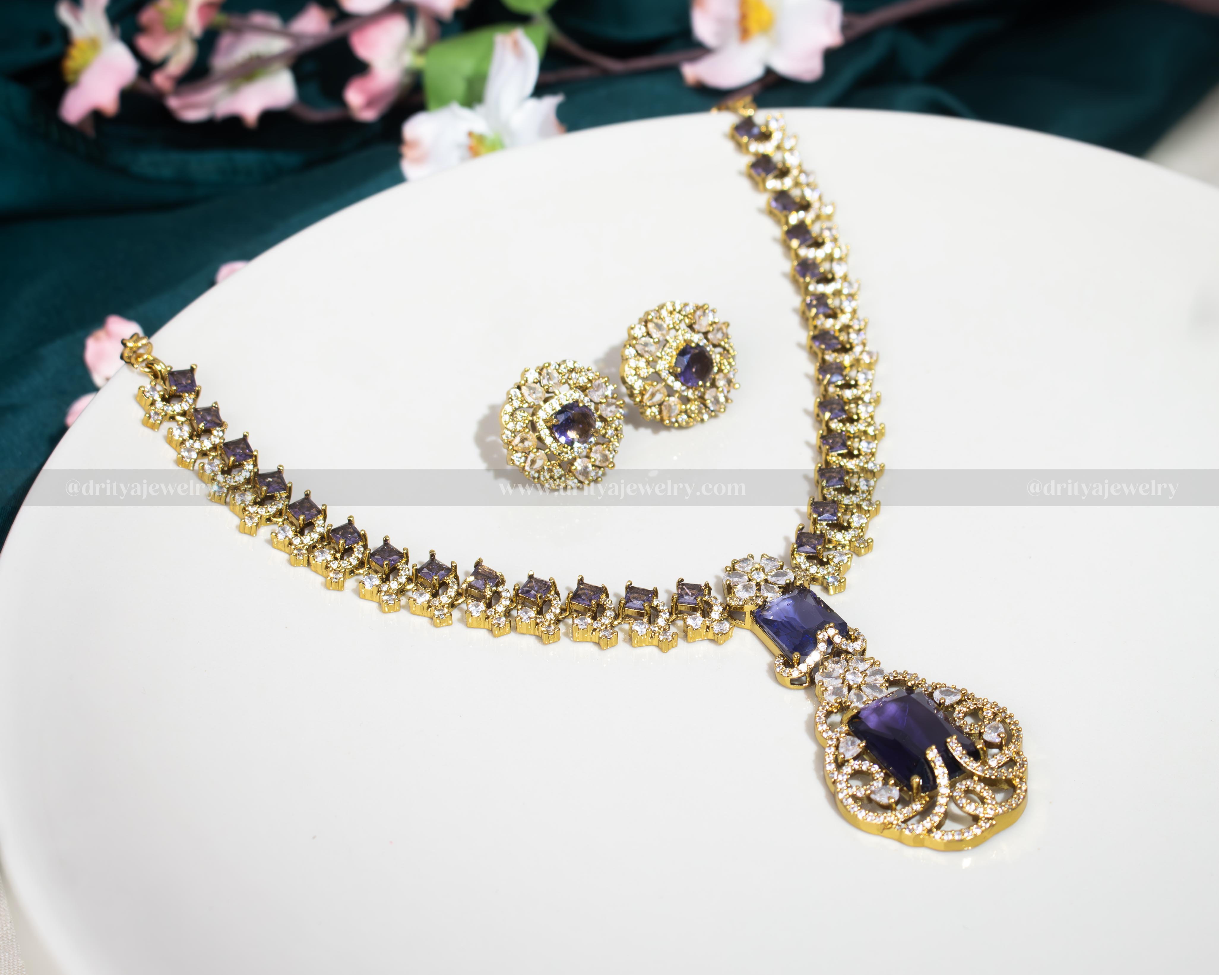 Dritya Jewelry's Elegant Dual Color CZ Necklace Set in emerald and purple, perfect for enhancing evening or bridal wear with exquisite style.