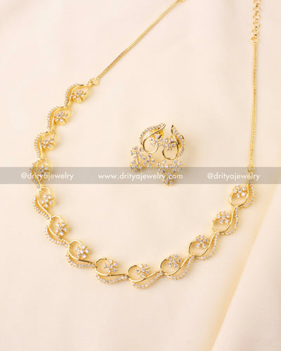 Minimalist short necklace with gold plating and American diamond floral accents
