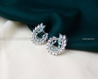 Mint green zircon earrings designed in a leaf motif with sparkling CZ stones.