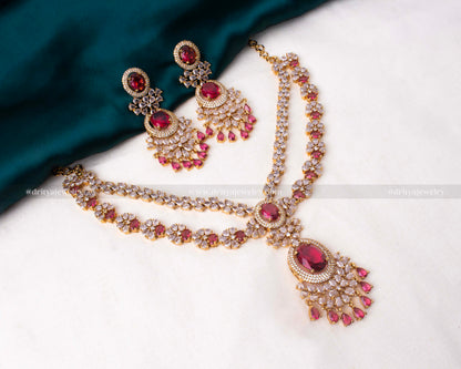 Exquisite layered necklace set with ruby and cubic zirconia on a golden base, perfect for enhancing evening wear.