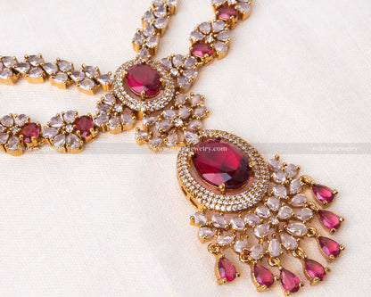 Exquisite layered necklace set with ruby and cubic zirconia on a golden base, perfect for enhancing evening wear.