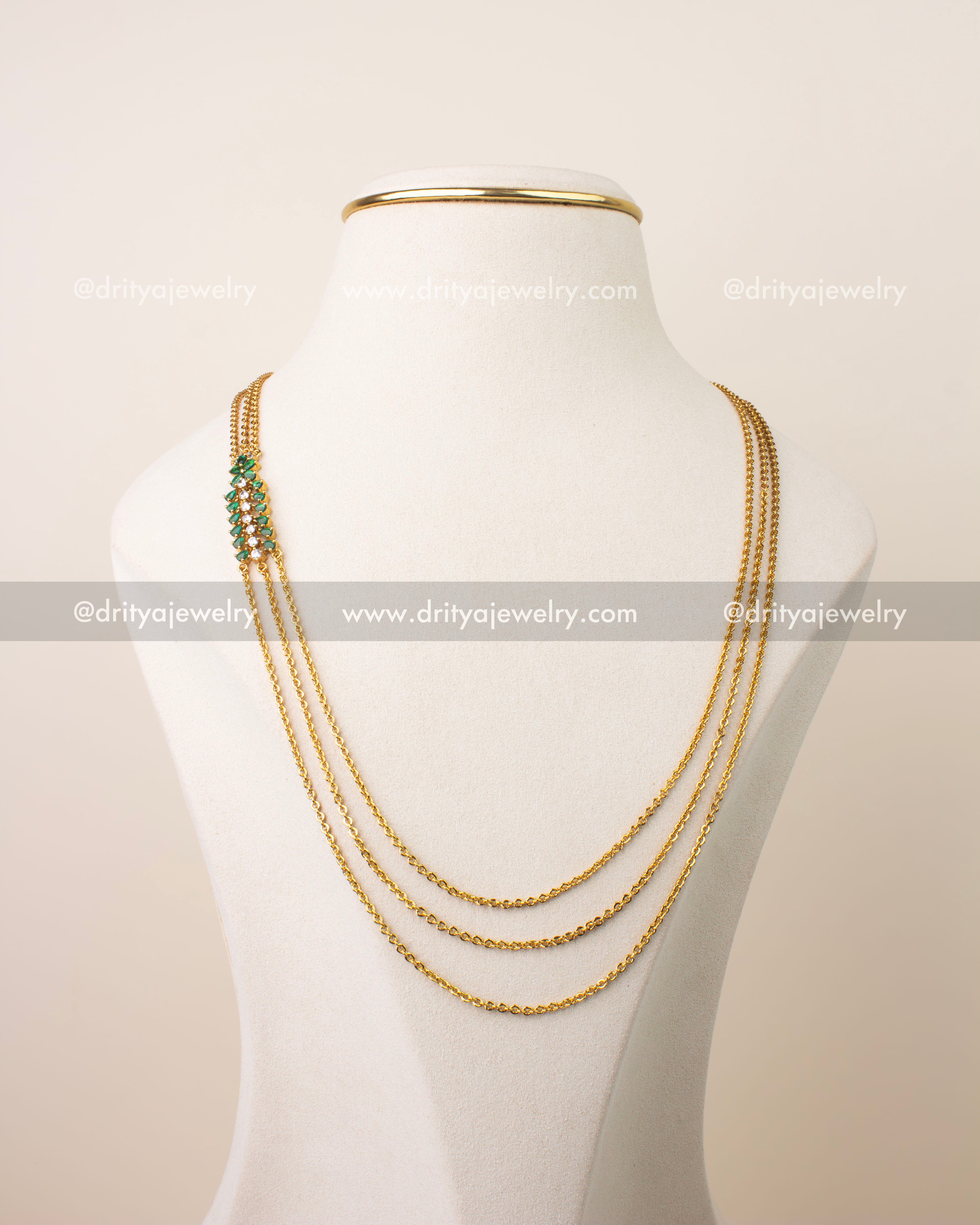Premium emerald green chandraharam necklace with high quality CZ stones and triple chain gold finish