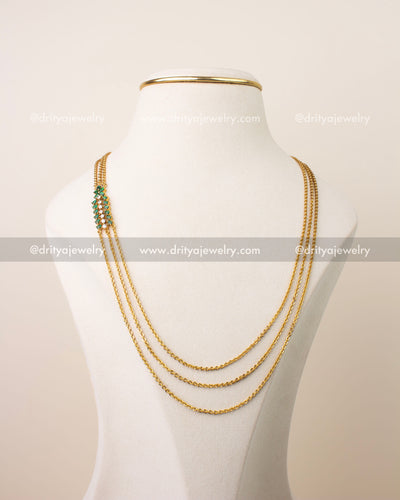 Premium emerald green chandraharam necklace with high quality CZ stones and triple chain gold finish