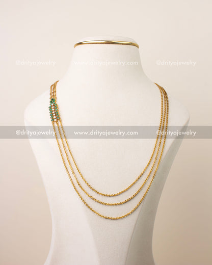 Premium emerald green chandraharam necklace with high quality CZ stones and triple chain gold finish