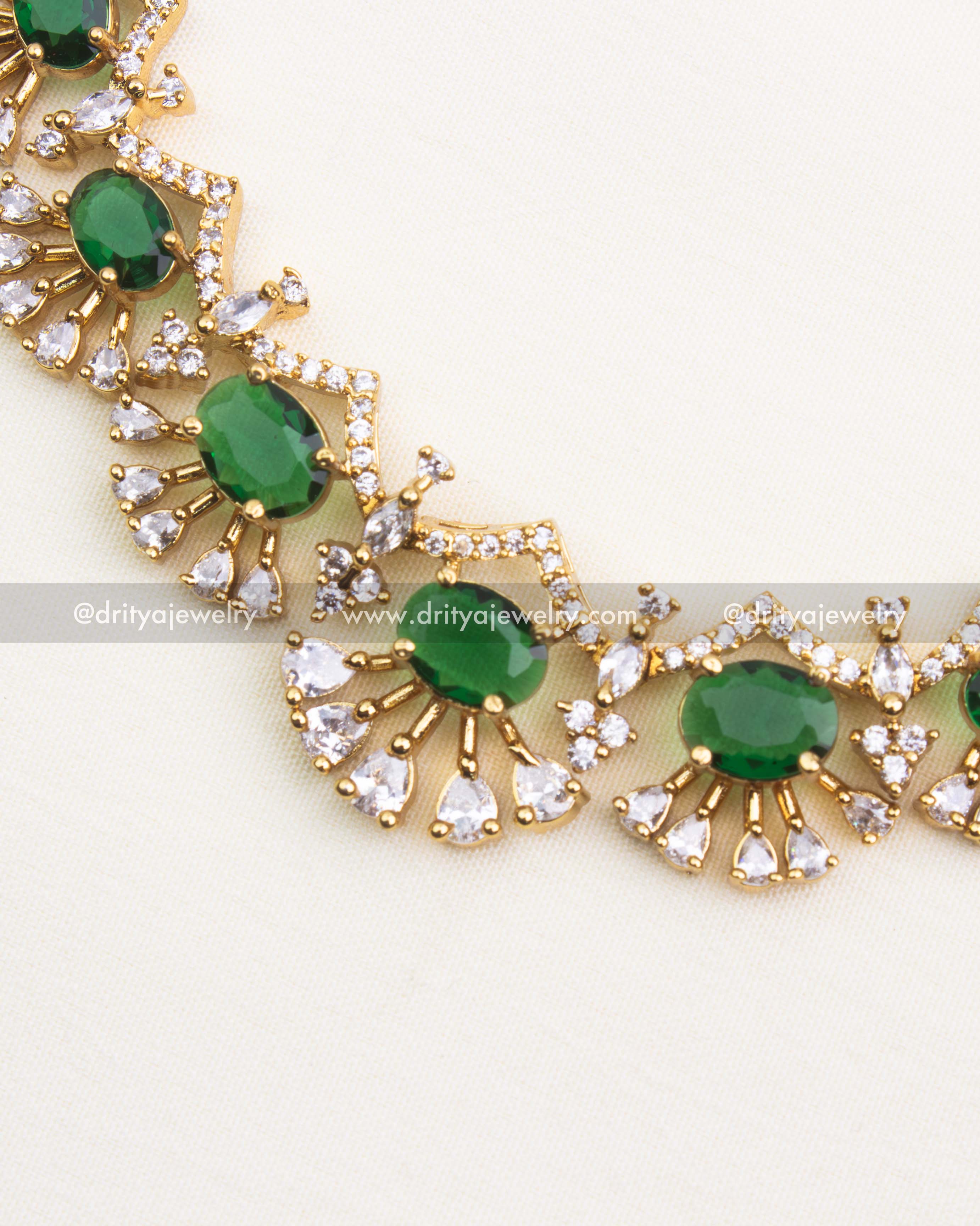 Premium emerald green short necklace set with CZ stones and radiant gold polish.