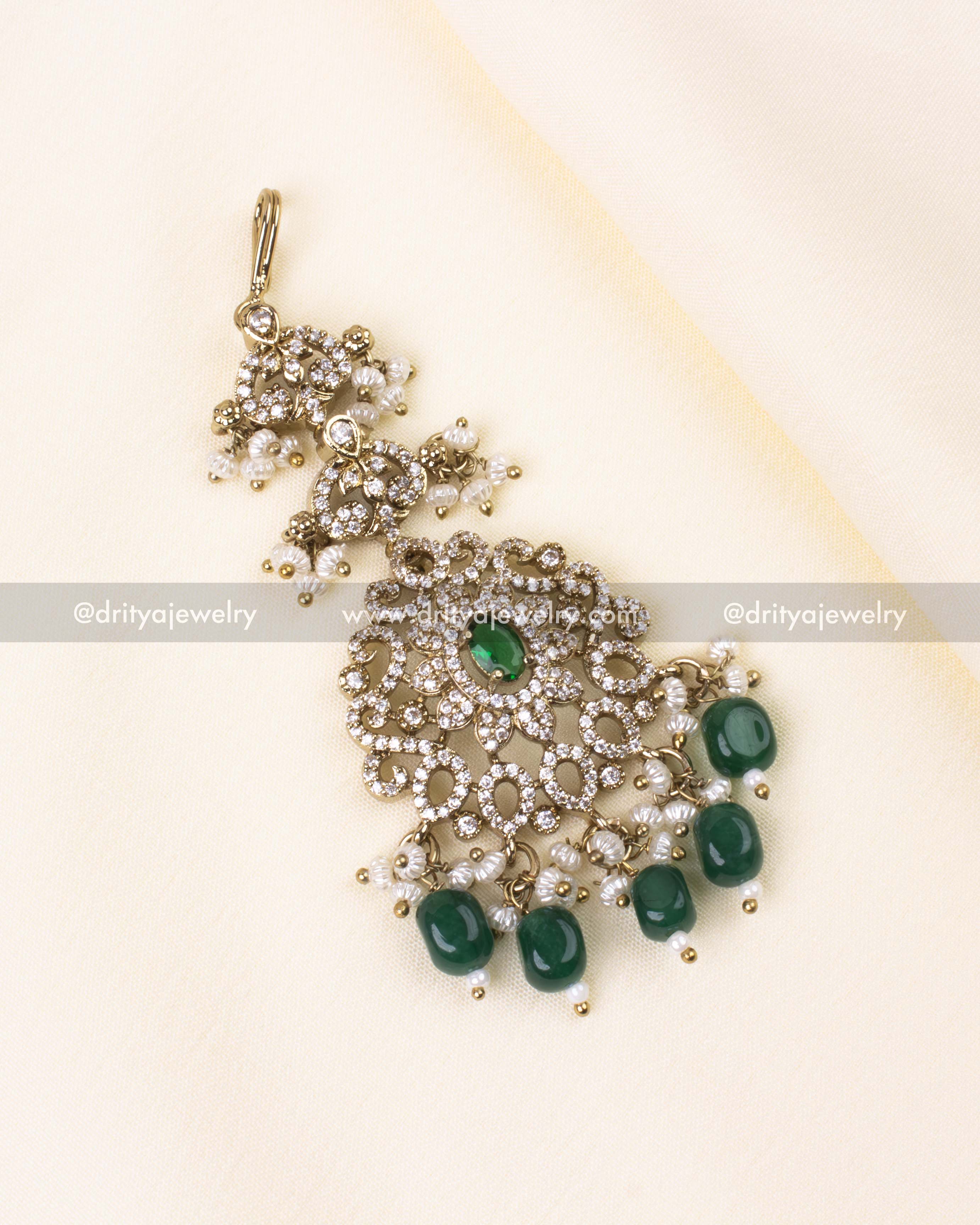 Green maang tikka in antique Victorian style with pearl and bead drops.
