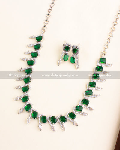 Silver-finished necklace with emerald green rectangular stones and American Diamonds
