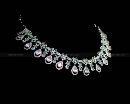 Side angle displaying the delicate zircon flower patterns and teardrop embellishments of the necklace.