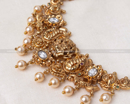 Elegant gold choker encrusted with gemstones and adorned with pearls, perfect for bridal wear and formal occasions.